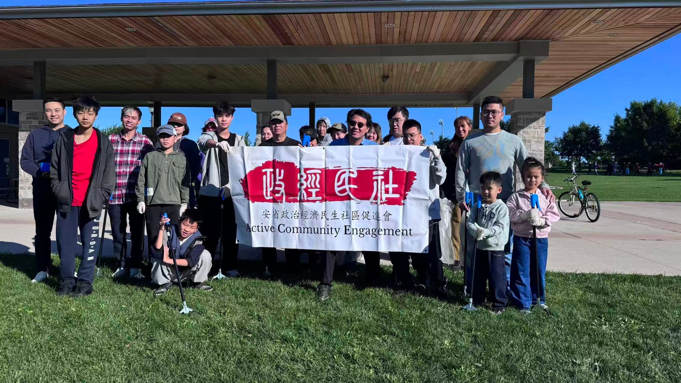 ACE volunteers and children with litter grabbers under the Berczy Park North pavilion